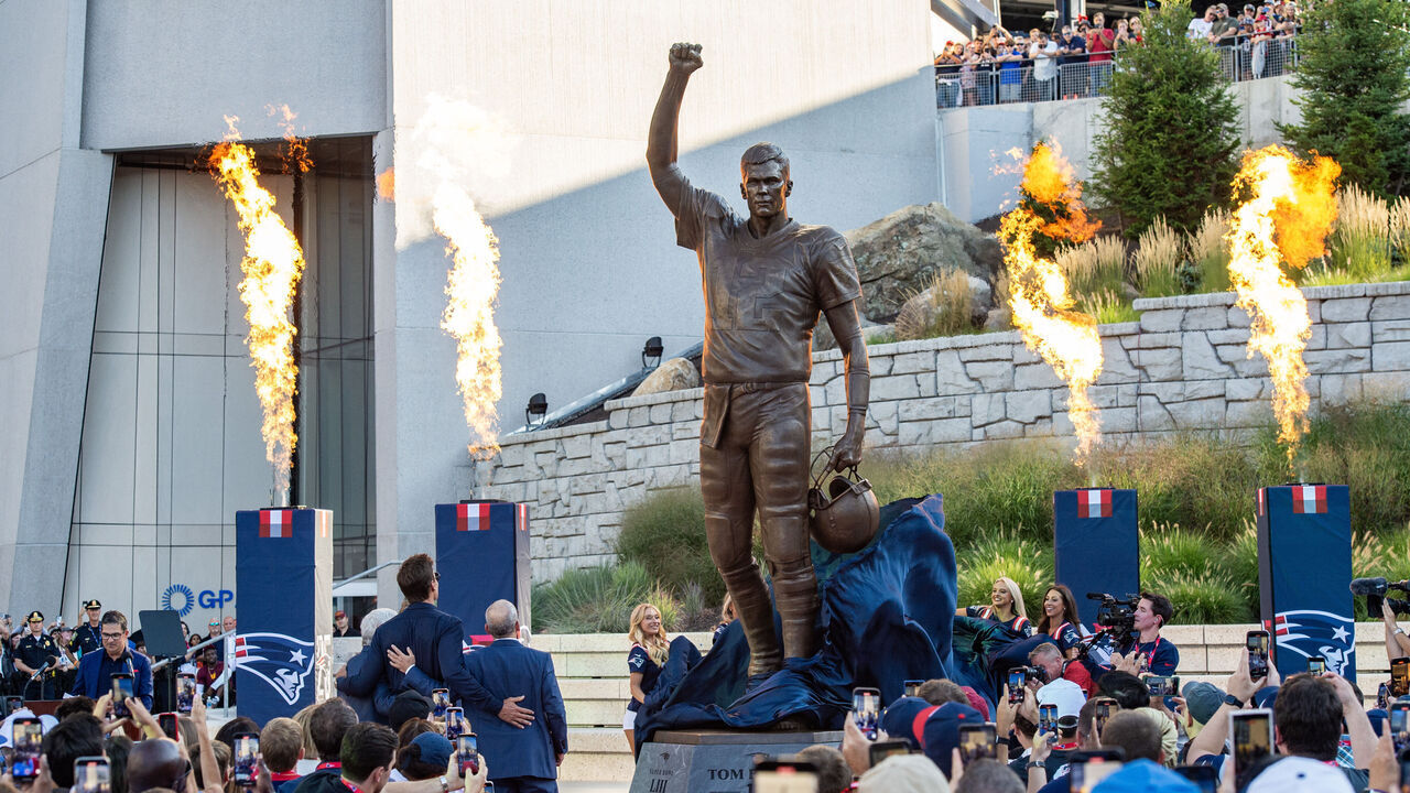 MASSACHUSETTS, UNITED STATES - AUGUST 8: Tom Brady stands with the Kraft Family as his statue is unveiled during the ceremony at Gillette Stadium in Foxborough, Massachusetts in August 8, 2025. Tom Brady took the Patriots to six Super Bowl titles and 17 division championships in the 18 seasons he played for them as a starter.