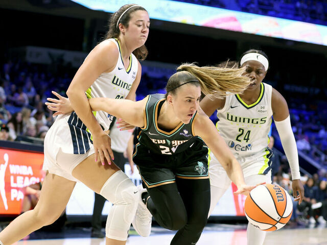 ARLINGTON, TEXAS - AUGUST 08: Sabrina Ionescu #20 of the New York Liberty goes to the basket against Maddy Siegrist #20 and Arike Ogunbowale #24 of the Dallas Wings during the fourth quarter at College Park Center on August 08, 2025 in Arlington, Texas. NOTE TO USER: User expressly acknowledges and agrees that, by downloading and/or using this photograph, user is consenting to the terms and conditions of the Getty Images License Agreement.