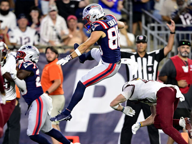 FOXBOROUGH, MASSACHUSETTS - AUGUST 08: Efton Chism III #86 of the New England Patriots scores a touchdown during the third quarter of the NFL Preseason 2025 game against Washington Commanders and New England Patriots at Gillette Stadium on August 08, 2025 in Foxborough, Massachusetts.