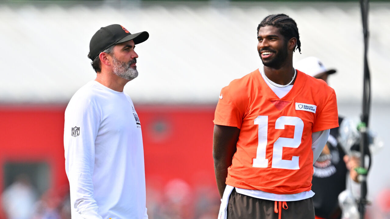 BEREA, OHIO - JULY 26: Head coach Kevin Stefanski talks to quarterback Shedeur Sanders #12 of the Cleveland Browns during training camp at CrossCountry Mortgage Campus on July 26, 2025 in Berea, Ohio.