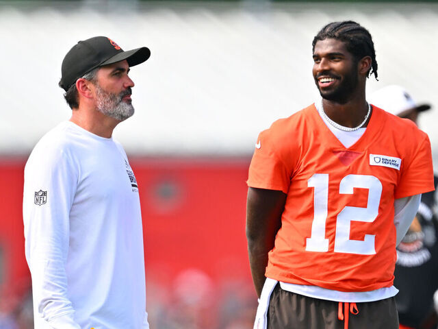 BEREA, OHIO - JULY 26: Head coach Kevin Stefanski talks to quarterback Shedeur Sanders #12 of the Cleveland Browns during training camp at CrossCountry Mortgage Campus on July 26, 2025 in Berea, Ohio.