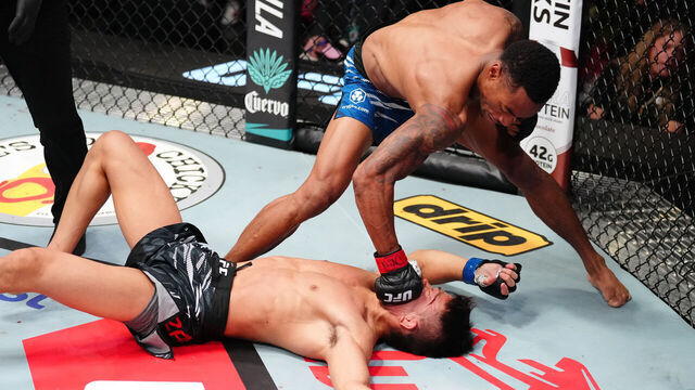 LAS VEGAS, NEVADA - AUGUST 09: (R-L) Elijah Smith knocks out Toshiomi Kazama of Japan in a bantamweight fight during the UFC Fight Night event at UFC APEX on August 09, 2025 in Las Vegas, Nevada.
