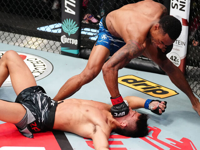LAS VEGAS, NEVADA - AUGUST 09: (R-L) Elijah Smith knocks out Toshiomi Kazama of Japan in a bantamweight fight during the UFC Fight Night event at UFC APEX on August 09, 2025 in Las Vegas, Nevada.