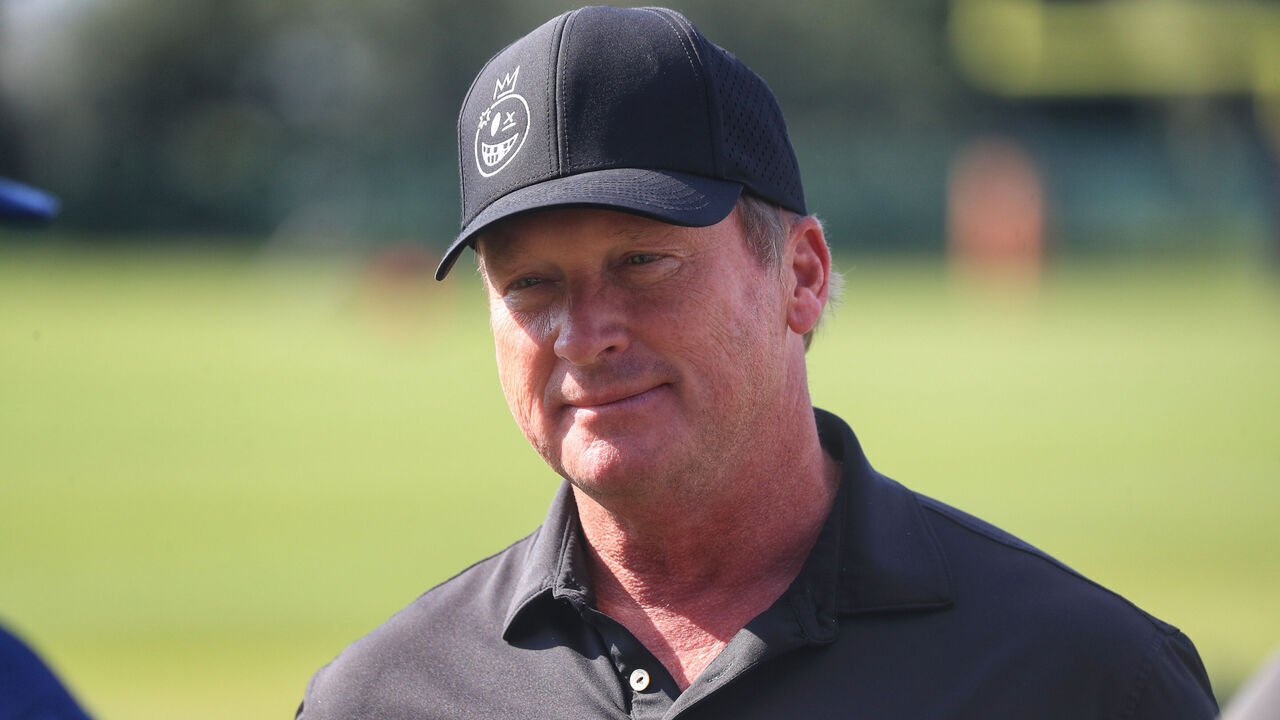 TAMPA, FL - AUGUST 07: Former Tampa Bay Buccaneers Super Bowl winning Head Coach Jon Gruden visits with friends during the Titans - Buccaneers Joint Training Camp work out on August 07, 2025 at the AdventHealth Training Center at One Buccaneer Place in Tampa, Florida.