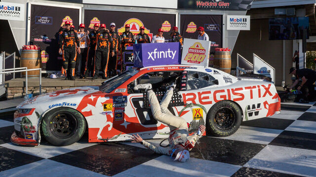 WATKINS GLEN, NY - AUGUST 09: After winning the Mission 200 Connor Zilisch (#88 JR Motorsports Registix Chevrolet) falls from his Registix Chevrolet and hits his head on landing in Victory lane At The Glen on August 09, 2025, at Watkins Glen International in Watkins Glen, NY.