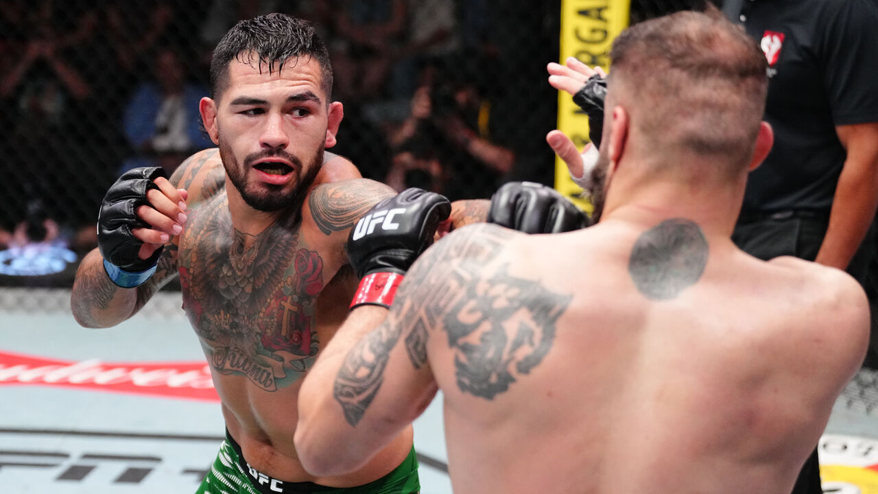 LAS VEGAS, NEVADA - AUGUST 09: (L-R) Anthony Hernandez punches Roman Dolidze of Georgia in a middleweight fight during the UFC Fight Night event at UFC APEX on August 09, 2025 in Las Vegas, Nevada.