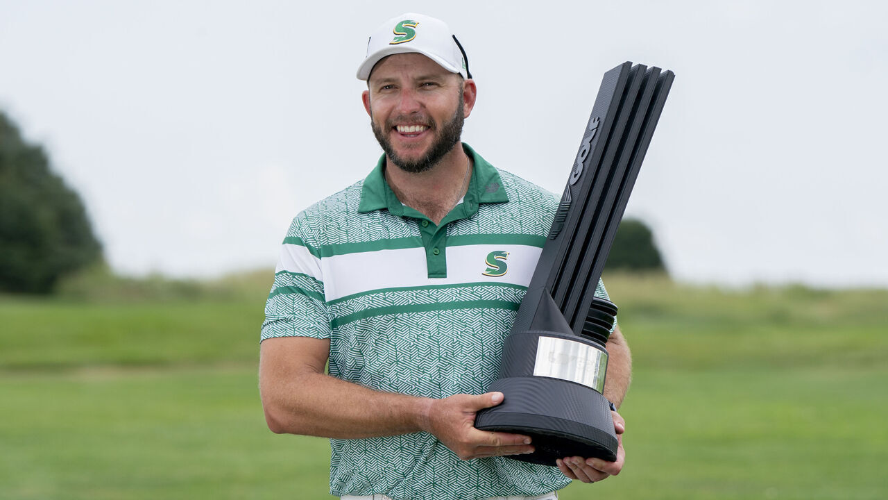 BOLINGBROOK, IL - AUGUST 10: LIV Golf Chicago individual champion Dean Burmester poses with the individual championship trophy after the final round of LIV Golf Chicago on Sunday, August 10, 2025 at Bolingbrook Golf Club in Bolingbrook, IL