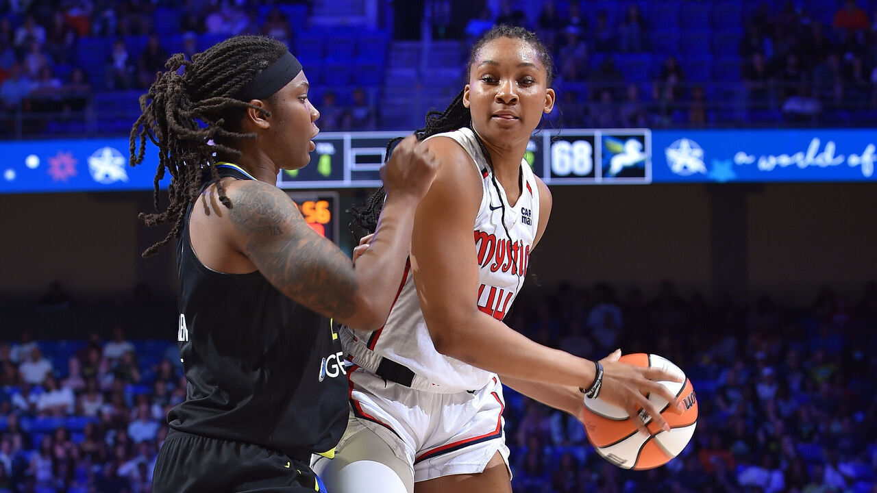 ARLINGTON, TX - AUGUST 10: Kiki Iriafen #44 of the Washington Mystics looks to pass the ball during the game against the Dallas Wings on August 10, 2025 at the College Park Center in Arlington, TX. Mandatory Copyright Notice: Copyright 2025 NBAE