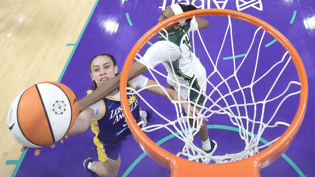 LOS ANGELES, CALIFORNIA - AUGUST 10: Dearica Hamby #5 of the Los Angeles Sparks shoots the game-winning shot against Dominique Malonga #14 of the Seattle Storm during the fourth quarter at Crypto.com Arena on August 10, 2025 in Los Angeles, California.