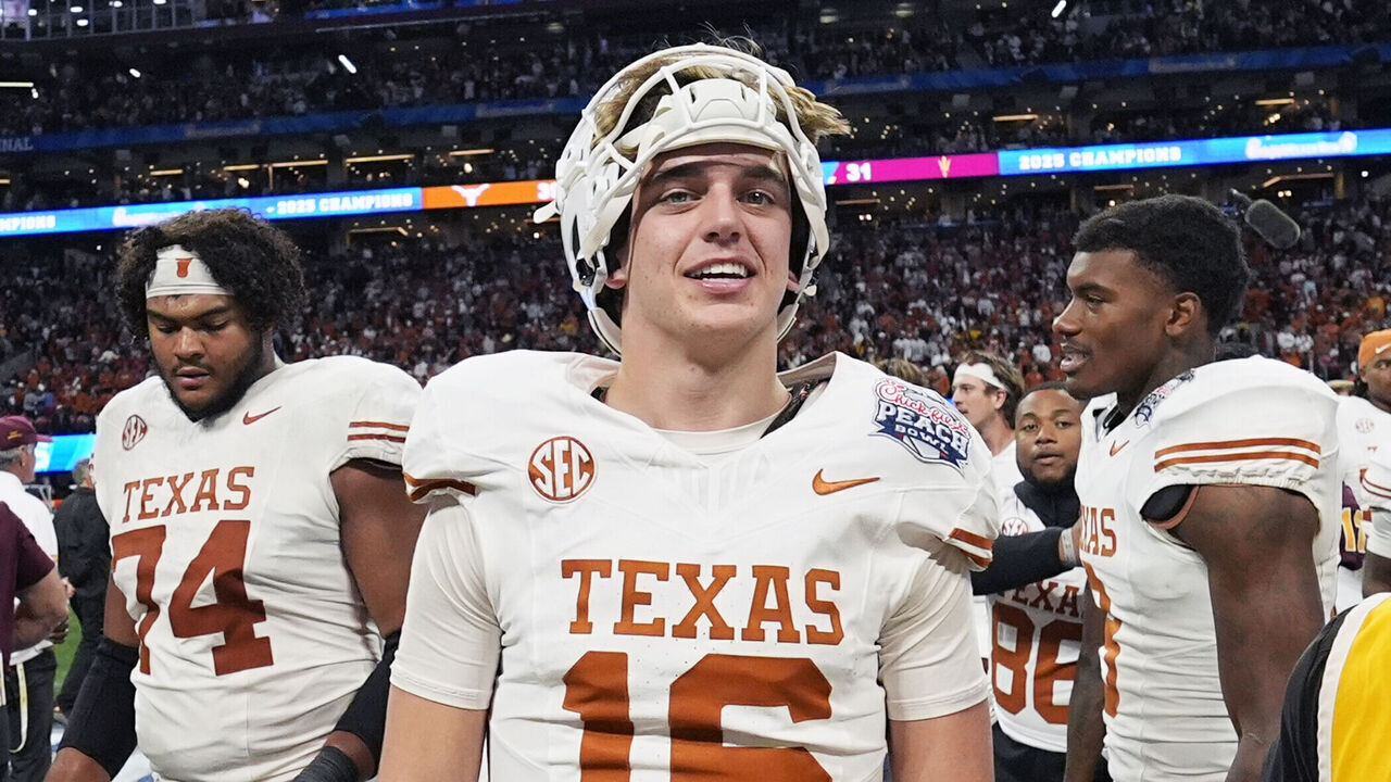 ATLANTA, GA - JANUARY 01: Quarterback Arch Manning #16 of the Texas Longhorns looks on after the Texas Longhorns versus Arizona State Sun Devils College Football Playoff Quarterfinal at the Chick-fil-A Peach Bowl on January 1, 2025, at Mercedes-Benz Stadium in Atlanta, GA.