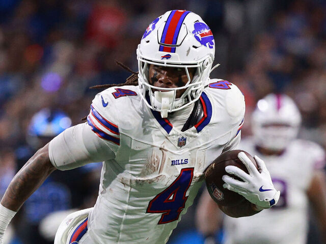 DETROIT,MICHIGAN-December 15: Buffalo Bills running back James Cook #4 carries the ball for a touchdown during the second half of an NFL football game between the Buffalo Bills and the Detroit Lions at Ford Field in Detroit, Michigan USA, on Sunday, December 15, 2024.