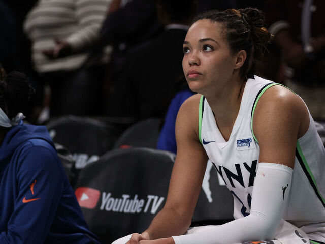NEW YORK, NEW YORK - OCTOBER 20: Napheesa Collier #24 of the Minnesota Lynx looks on from the bench during overtime during Game Five of the WNBA Finals at Barclays Center on October 20, 2024 in New York City.