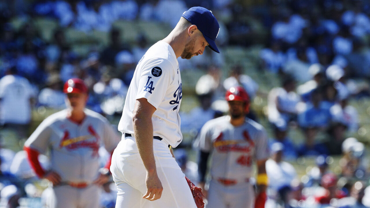 LOS ANGELES, CA - AUGUST 6, 2025: Los Angeles Dodgers pitcher Brock Stewart (41) walks back to the mound after he gave up an RBI double to St. Louis Cardinals outfielder Lars Nootbaar (21) in the ninth inning at Dodger Stadium on August 6, 2025 in Los Angeles, California.(Gina Ferazzi / Los Angeles Times via Getty Images)