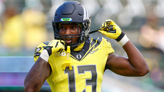 EUGENE, OREGON - OCTOBER 26: Jurrion Dickey #13 of the Oregon Ducks warms up prior to a game against the Illinois Fighting Illini at Autzen Stadium on October 26, 2024 in Eugene, Oregon.