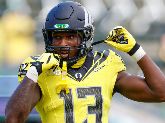 EUGENE, OREGON - OCTOBER 26: Jurrion Dickey #13 of the Oregon Ducks warms up prior to a game against the Illinois Fighting Illini at Autzen Stadium on October 26, 2024 in Eugene, Oregon.