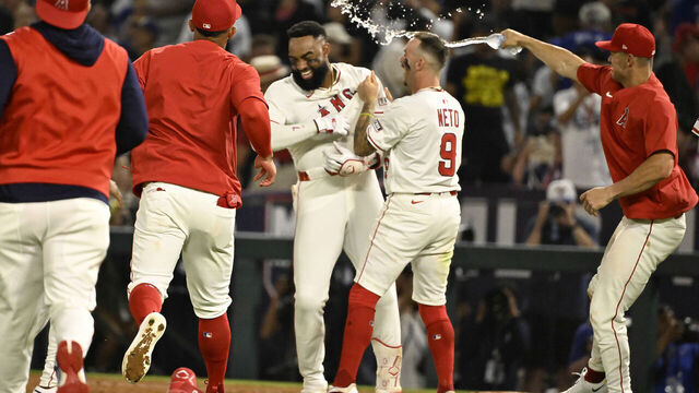 Anaheim, CA - August 12: Jo Adell #7 of the Los Angeles Angels reacts after hitting a walk off single as teammate Zach Neto (not pictured) scores the winning run to defat the Los Angeles Dodgers 7-6 in the tenth inning during a baseball game at Angel Stadium in Anaheim on Tuesday, August 12, 2025.