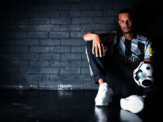 NEWCASTLE UPON TYNE, ENGLAND - AUGUST 12: Malick Thiaw poses for photos in a home shirt after signing for Newcastle United on August 12, 2025 in Newcastle upon Tyne, England.