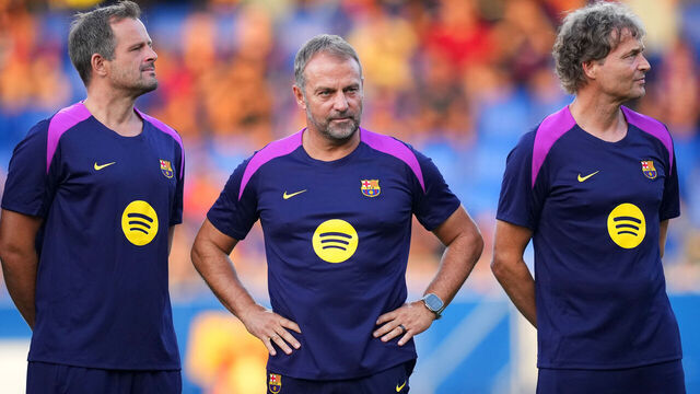 BARCELONA, SPAIN - AUGUST 10: Hansi Flick, Head Coach of FC Barcelona, and his staff look on during the Joan Gamper Trophy match between FC Barcelona and Como1907 at Estadi Johan Cruyff on August 10, 2025 in Barcelona, Spain.