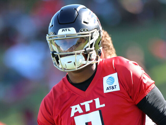 FLOWERY BRANCH, GA - JULY 27: Atlanta Falcons quarterback Michael Penix Jr. #9 runs a play during Atlanta Falcons training camp on July 27, 2025 at IBM Performance Field in Flowery Branch, GA.