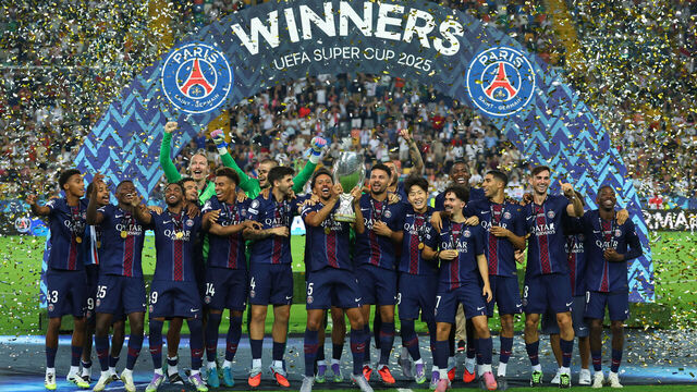 UDINE, ITALY - AUGUST 13: Marquinhos of Paris Saint-Germain holds aloft the trophy as they celebrate winning the 2025 UEFA Super Cup against Tottenham Hotspur during UEFA Super Cup 2025 match between Paris Saint-Germain and Tottenham Hotspur at Friuli Stadium on August 13, 2025 in Udine, Italy.