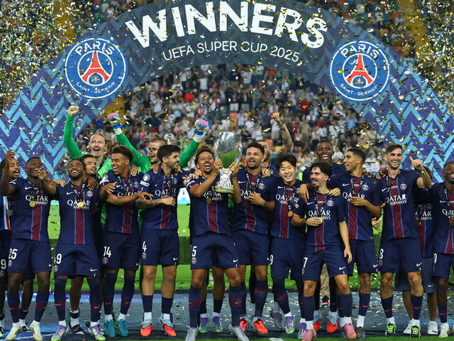 UDINE, ITALY - AUGUST 13: Marquinhos of Paris Saint-Germain holds aloft the trophy as they celebrate winning the 2025 UEFA Super Cup against Tottenham Hotspur during UEFA Super Cup 2025 match between Paris Saint-Germain and Tottenham Hotspur at Friuli Stadium on August 13, 2025 in Udine, Italy.
