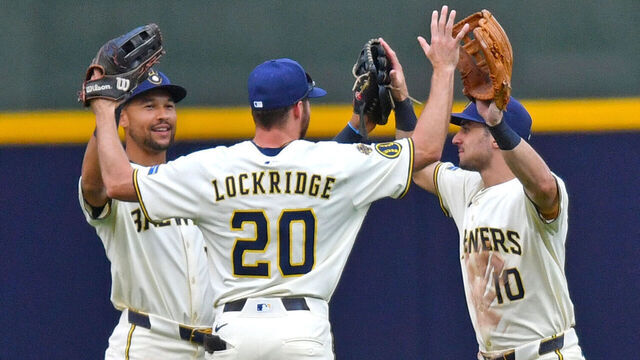 MILWAUKEE, WI - AUGUST 13: Blake Perkins #16 of the Milwaukee Brewers, Brandon Lockridge #20 of the Milwaukee Brewers, and Sal Frelick #10 of the Milwaukee Brewers celebrate after defeating the Pittsburgh Pirates in an MLB game on August 13, 2025, at American Family Field in Milwaukee, WI.