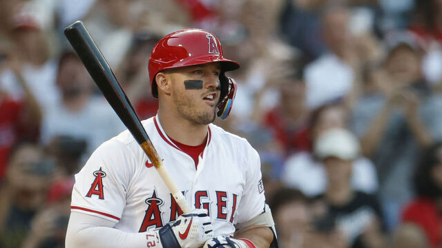 ANAHEIM, CALIFORNIA - AUGUST 13: Mike Trout #27 of the Los Angeles Angels reacts to his strike out during the first inning against Shohei Ohtani #17 of the Los Angeles Dodgers at Angel Stadium of Anaheim on August 13, 2025 in Anaheim, California.