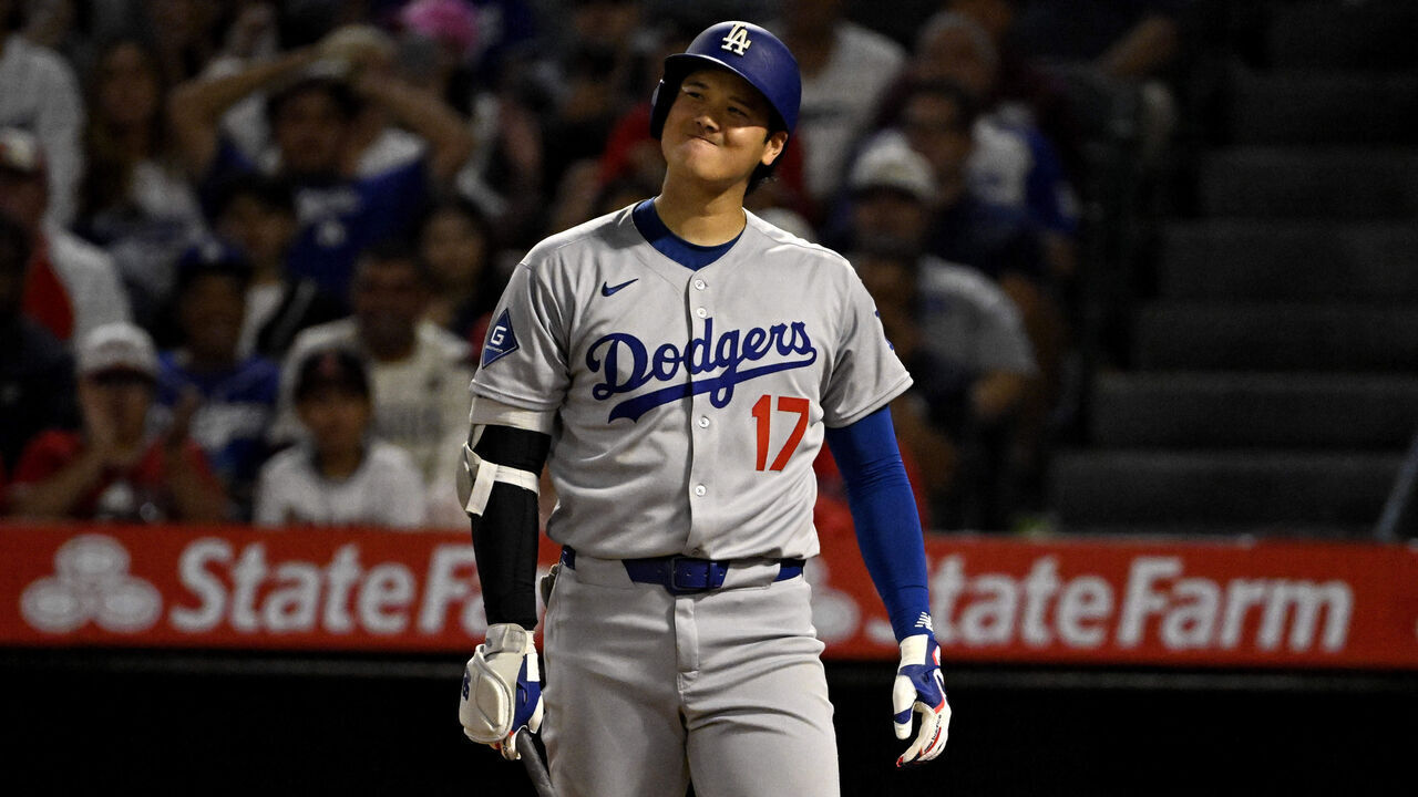 Anaheim, CA - August 13: Shohei Ohtani #17 of the Los Angeles Dodgers reacts after striking out looking against the Los Angeles Angels in the eighth inning of a baseball game at Angel Stadium in Anaheim on Wednesday, August 13, 2025.