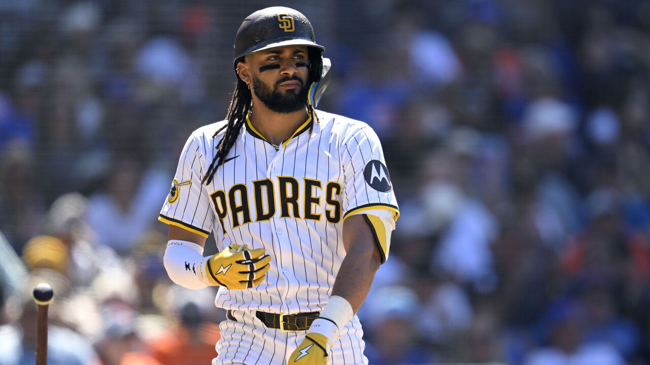 SAN DIEGO, CALIFORNIA - JULY 30: Fernando Tatis Jr. #23 of the San Diego Padres tosses his bat after a walk during the eighth inning against the New York Mets at Petco Park on July 30, 2025 in San Diego, California.
