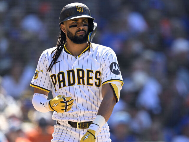 SAN DIEGO, CALIFORNIA - JULY 30: Fernando Tatis Jr. #23 of the San Diego Padres tosses his bat after a walk during the eighth inning against the New York Mets at Petco Park on July 30, 2025 in San Diego, California.