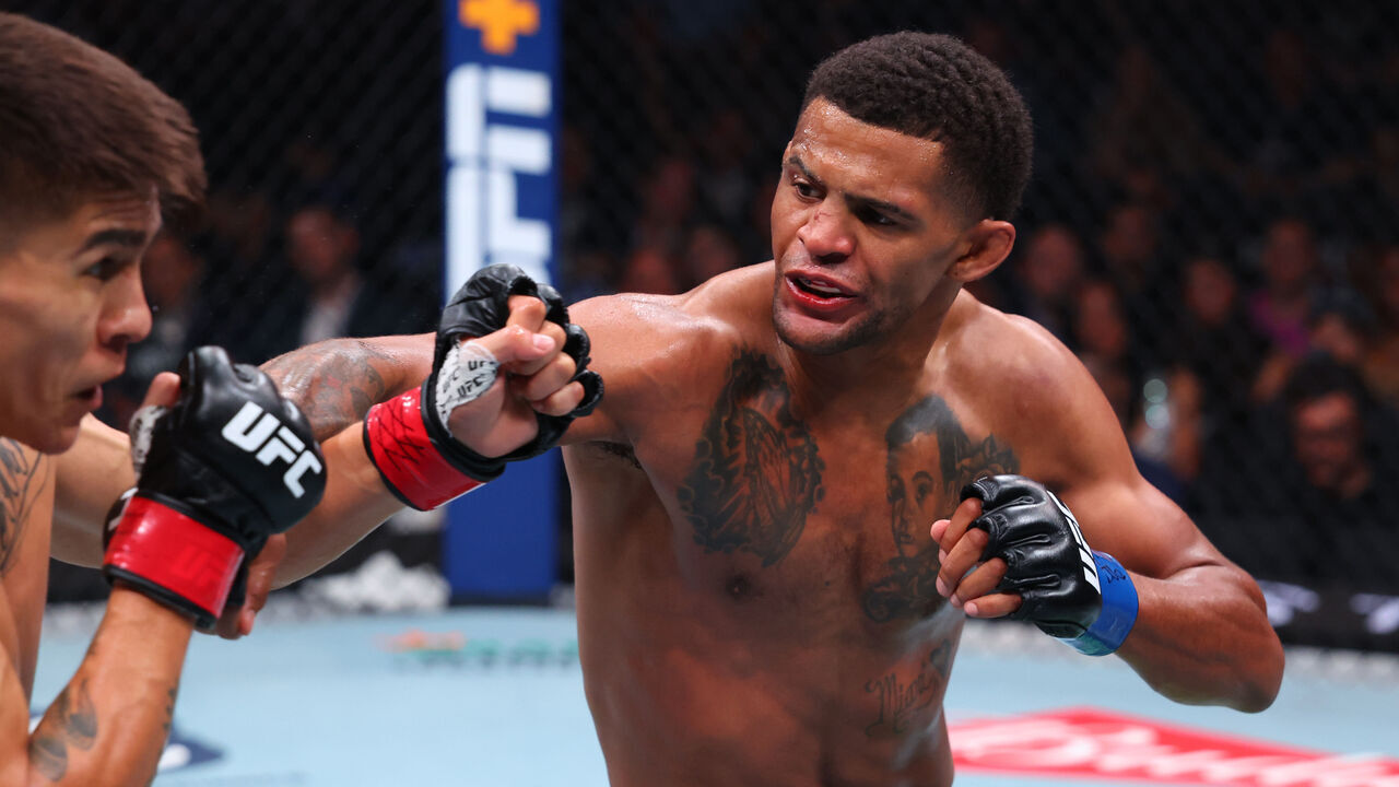 NEWARK, NEW JERSEY - JUNE 07: (R-L) Patchy Mix punches Mario Bautista in a bantamweight bout during the UFC 316 event at Prudential Center on June 07, 2025 in Newark, New Jersey.
