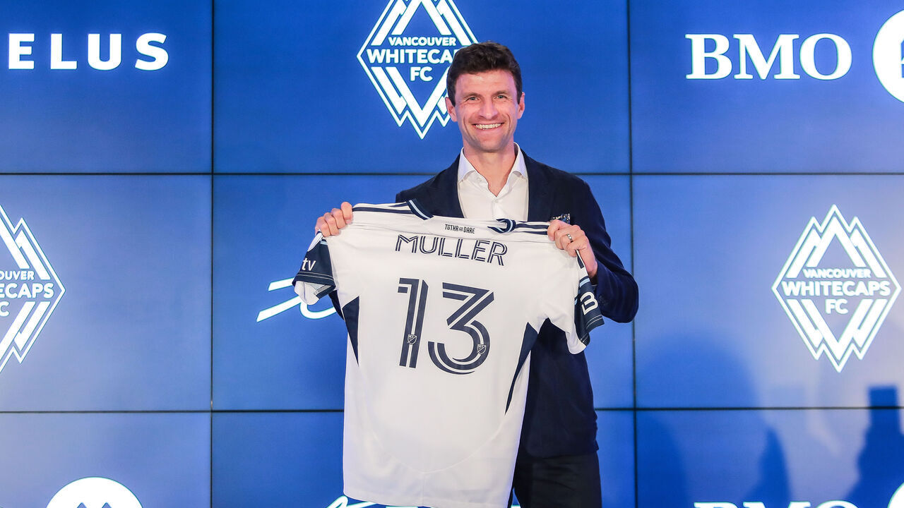 VANCOUVER, BRITISH COLUMBIA - AUGUST 14: German football player Thomas Müller holds his jersey as he was introduced by the Vancouver Whitecaps during a press conference at TELUS Garden on August 14, 2025 in Vancouver, British Columbia.