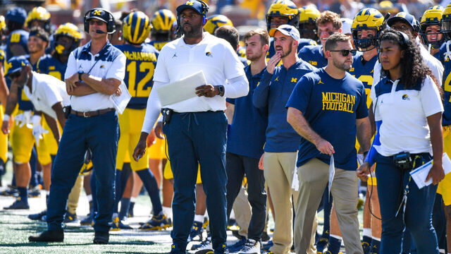 ANN ARBOR, MICHIGAN - SEPTEMBER 03: Head Football Coach Jim Harbaugh (L), Offensive Coordinator / Assistant Football Coach Sherrone Moore (C), and Assistant Football Coach Mimi Bolden-Morris (R) of the Michigan Wolverines are seen on the sideline during a college football game against the Colorado State Rams at Michigan Stadium on September 03, 2022 in Ann Arbor, Michigan.