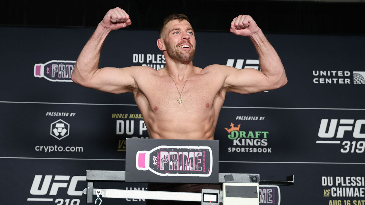 CHICAGO, ILLINOIS - AUGUST 15:Dricus Du Plessis poses on the scale during the UFC 319 official weigh-in at Voco Chicago Downtown on August 15, 2025 in Chicago, Illinois.