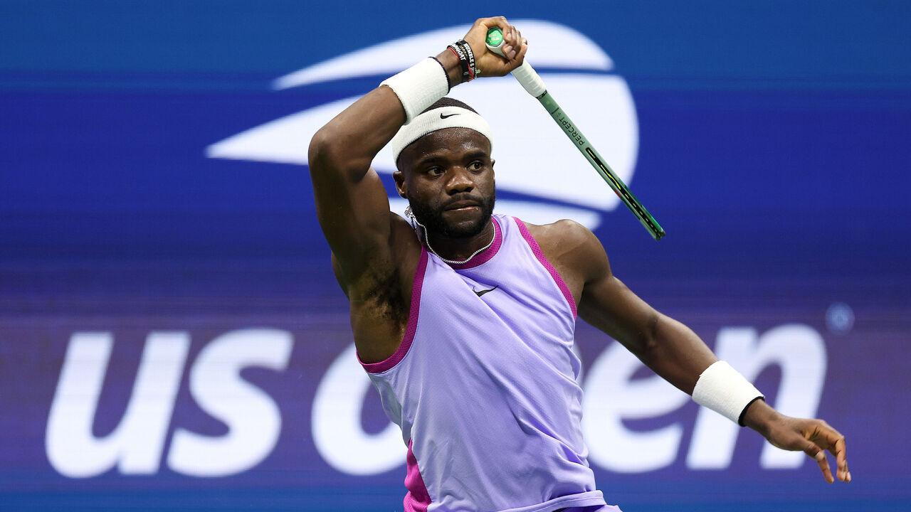 NEW YORK, NEW YORK - SEPTEMBER 06: Frances Tiafoe of the United States returns a shot against Taylor Fritz of the United States during their Men's Singles Semifinal match on Day Twelve of the 2024 US Open at USTA Billie Jean King National Tennis Center on September 06, 2024 in the Flushing neighborhood of the Queens borough of New York City.