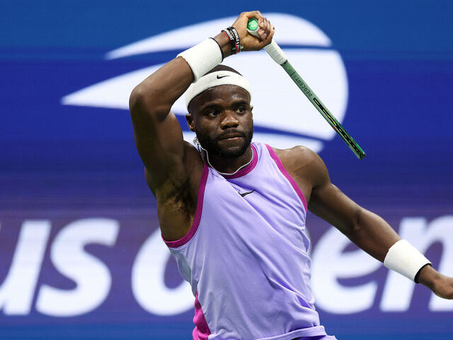 NEW YORK, NEW YORK - SEPTEMBER 06: Frances Tiafoe of the United States returns a shot against Taylor Fritz of the United States during their Men's Singles Semifinal match on Day Twelve of the 2024 US Open at USTA Billie Jean King National Tennis Center on September 06, 2024 in the Flushing neighborhood of the Queens borough of New York City.