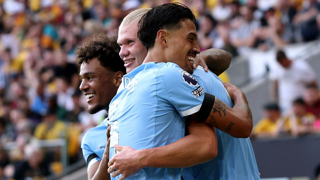 WOLVERHAMPTON, ENGLAND - AUGUST 16: Erling Haaland of Manchester City celebrates scoring his team's third goal with teammates Tijjani Reijnders and Oscar Bobb during the Premier League match between Wolverhampton Wanderers and Manchester City at Molineux on August 16, 2025 in Wolverhampton, England.