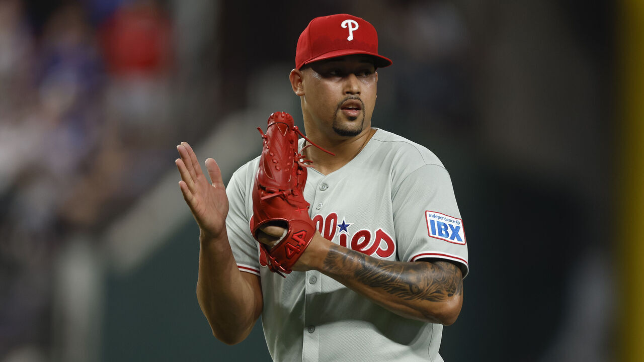 ARLINGTON, TEXAS - AUGUST 9: Jhoan Duran #59 of the Philadelphia Phillies celebrates after the final out in a team victory over the Texas Rangers at Globe Life Field on August 9, 2025 in Arlington, Texas.