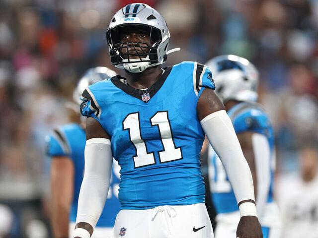 CHARLOTTE, NORTH CAROLINA - AUGUST 08: Linebacker Nic Scourton #11 of the Carolina Panthers looks on in the first half during the NFL Preseason 2025 game against the Cleveland Browns at Bank of America Stadium on August 08, 2025 in Charlotte, North Carolina.