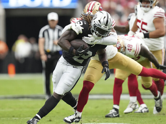 LAS VEGAS, NEVADA - AUGUST 16: Ashton Jeanty #2 of the Las Vegas Raiders is tackled by Ji'Ayir Brown #27 of the San Francisco 49ers in the first quarter during the NFL Preseason 2025 game at Allegiant Stadium on August 16, 2025 in Las Vegas, Nevada.