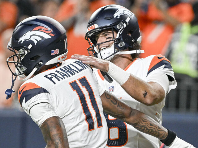DENVER, CO - AUGUST 16: Troy Franklin (11) of the Denver Broncos and Jarrett Stidham (8) celebrate their pass-catch touchdown against the Arizona Cardinals during the first quarter at Empower Field at Mile High in Denver, Colorado on Saturday, August 16, 2025.