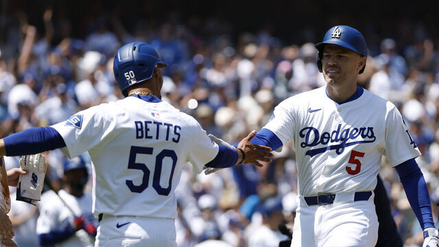 LOS ANGELES, CALIFORNIA - AUGUST 17: Freddie Freeman #5 of the Los Angeles Dodgers celebrates his three run home run with Mookie Betts #50 and Shohei Ohtani #17, in front of Freddy Fermin #54 of the San Diego Padres, to take a 3-0 lead, during the first inning in the game between the San Diego Padres and the Los Angeles Dodgers at Dodger Stadium on August 17, 2025 in Los Angeles, California.