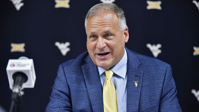 FRISCO, TX - JULY 09: West Virginia Mountaineers coach Rich Rodriguez talks to reporters during day two of Big 12 Media Days on Wednesday, July 09, 2025 at the Ford Center at The Star in Frisco, TX.