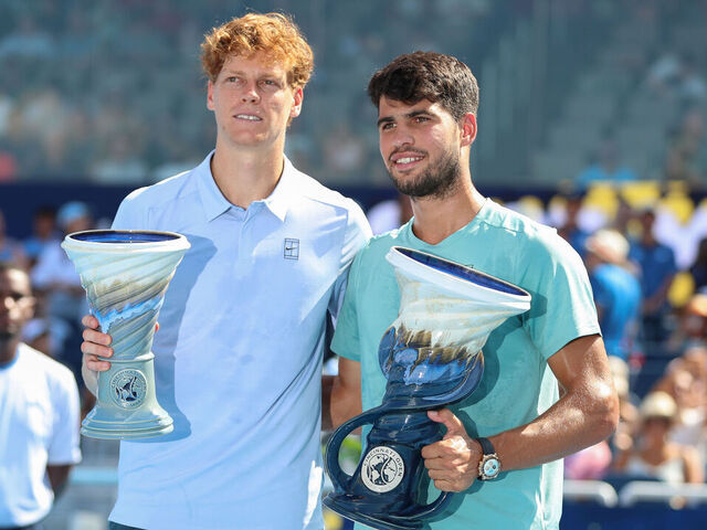 CINCINNATI, OH - AUGUST 18: Jannik Sinner of Italy poses with Carlos Alcaraz of Spain. Alcaraz won the men's title due to an early retirement by Sinner at the Cincinnati Open at the Lindner Family Tennis Center on August 18, 2025 in Mason, OH.