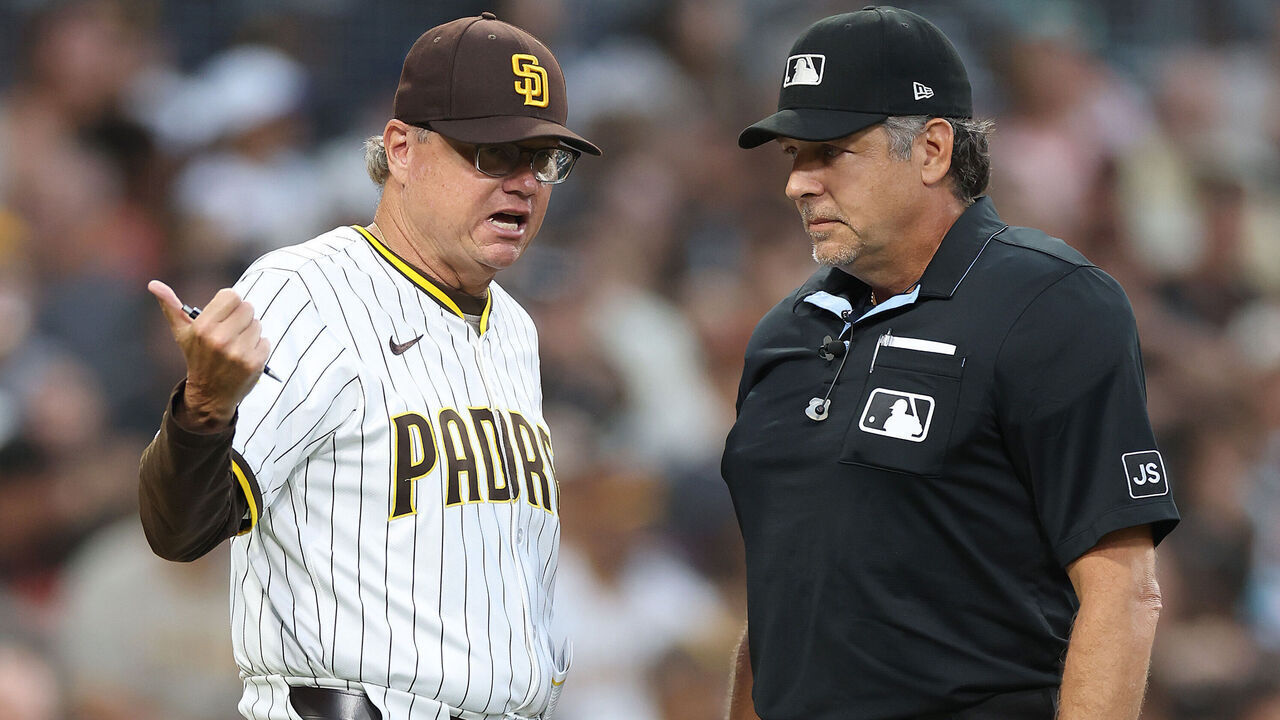 SAN DIEGO, CALIFORNIA - AUGUST 18: Manager Mike Shildt of talks with home plate umpire James Hoye #92 after a homerun hit by Xander Bogaerts #2 of the San Diego Padres was overturned due to fan interference during the second inning of a game at Petco Park on August 18, 2025 in San Diego, California.