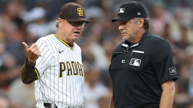 SAN DIEGO, CALIFORNIA - AUGUST 18: Manager Mike Shildt of talks with home plate umpire James Hoye #92 after a homerun hit by Xander Bogaerts #2 of the San Diego Padres was overturned due to fan interference during the second inning of a game at Petco Park on August 18, 2025 in San Diego, California.