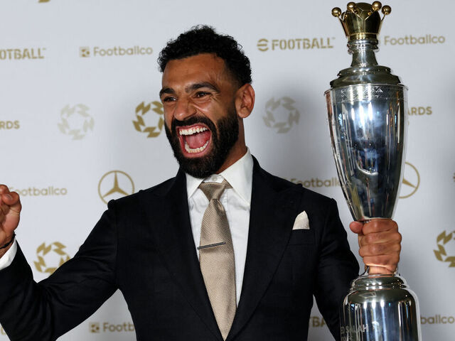 Liverpool's Egyptian striker Mohamed Salah poses with the Men's PFA Players' Player of the Year award backstage during the 2024-2025 Professional Footballers' Association (PFA) awards, at the Opera House in Manchester, northern England, on August 19, 2025.