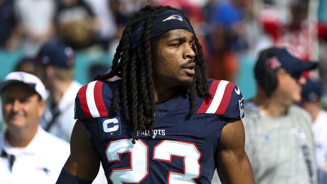 MIAMI GARDENS, FLORIDA - NOVEMBER 24: Kyle Dugger #23 of the New England Patriots stands on the sidelines during the national anthem prior to an NFL football game against the Miami Dolphins at Hard Rock Stadium on November 24, 2024 in Miami Gardens, Florida.