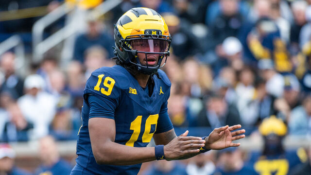 ANN ARBOR, MICHIGAN - APRIL 19: Bryce Underwood #19 of the Michigan Wolverines prepares to receive the ball during the second half of the Michigan Maize vs Blue Spring Football Game at Michigan Stadium on April 19, 2025 in Ann Arbor, Michigan.