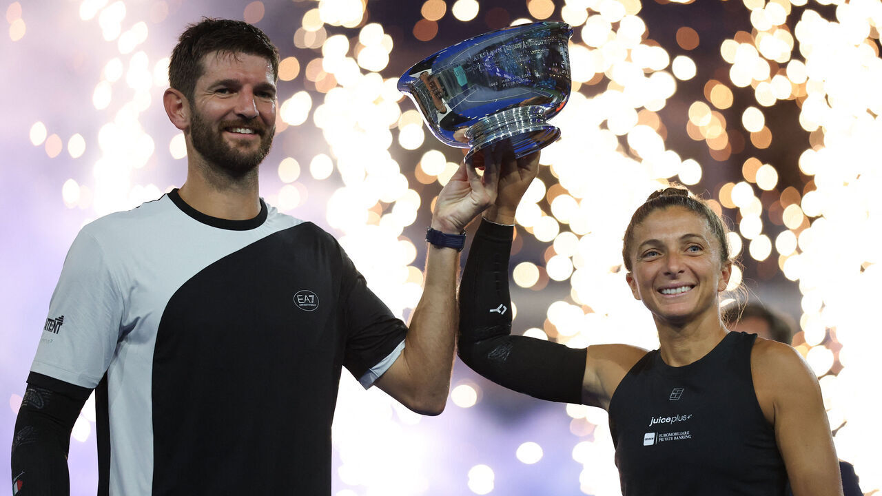 Italy's Andrea Vavassori (L) and Sara Errani celebrate with the trophy after winning their mixed doubles final tennis match against Norway's Casper Ruud and Poland's Iga Swiatek at the US Open tennis tournament at the USTA Billie Jean King National Tennis Center in New York City, on August 20, 2025.
